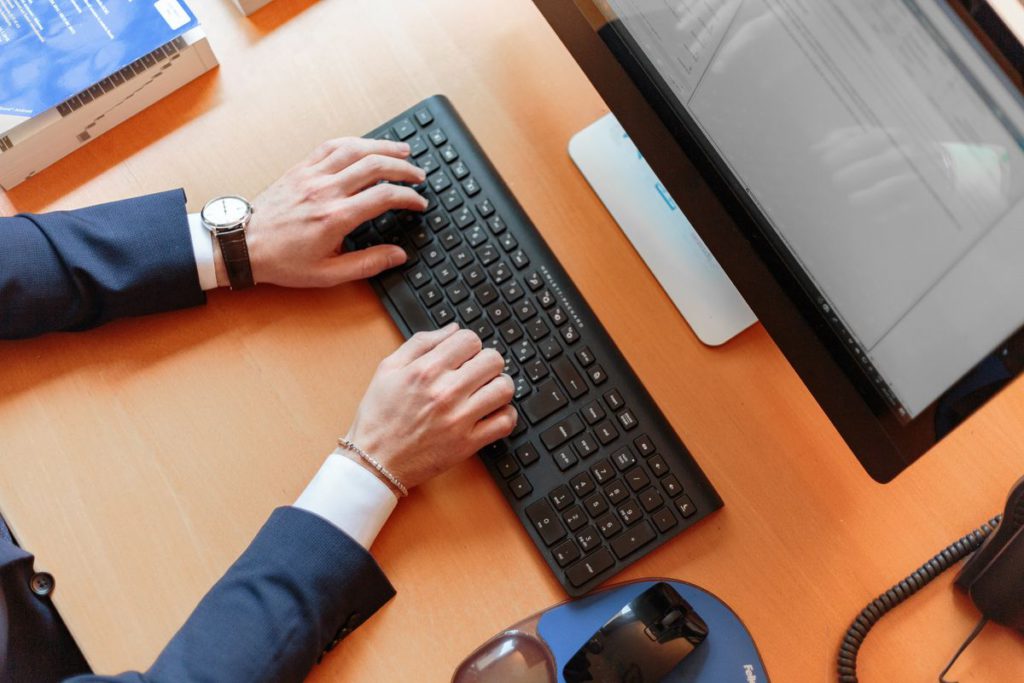 An image showing someone typing on a keyboard.