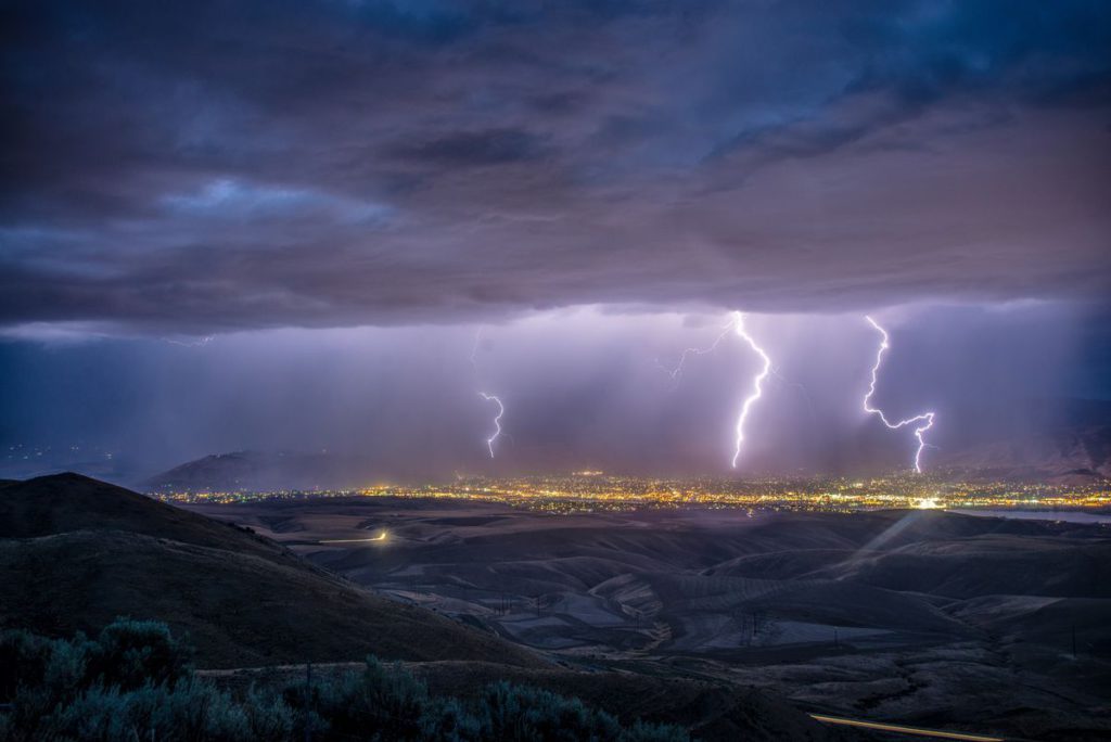 An image showing a storm over a city.