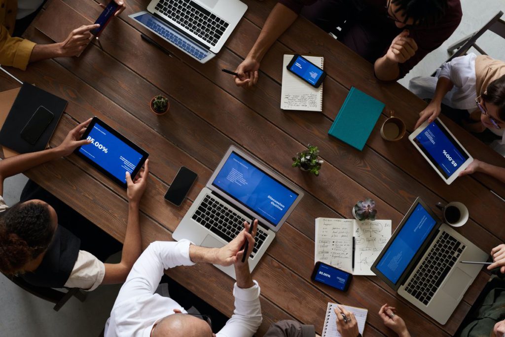 An image showing people working at a table.