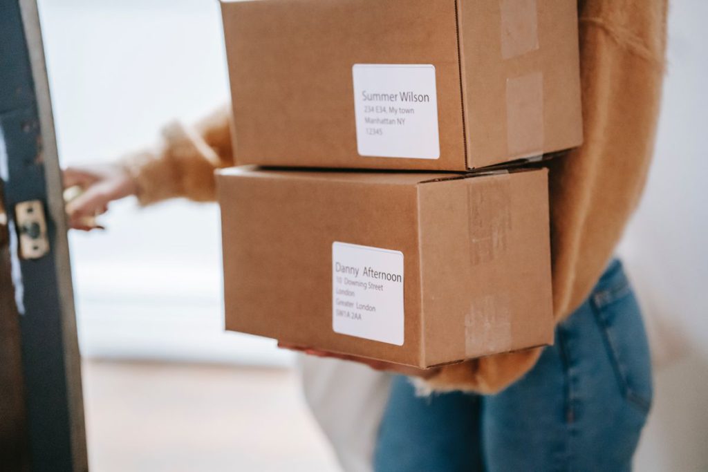 An image showing a person carrying boxes.