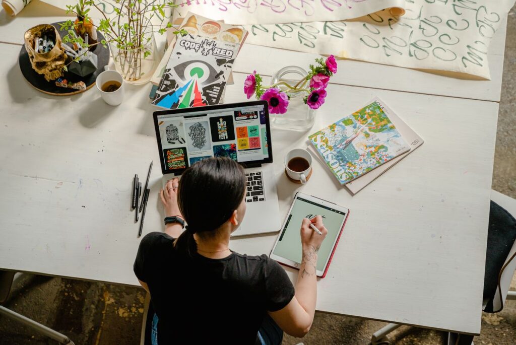 An image showing a woman in front of a laptop.