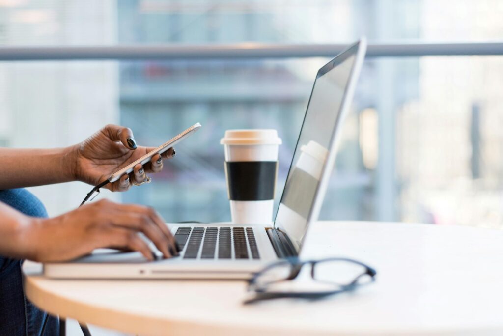 An image showing someone working on a laptop.